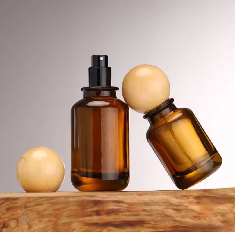 New Luxury Cylinder Shape Amber Spray Glass Bottle 30ml 50ml 100ml Cosmetic Amber Perfume Bottle With Round Wooden Lids